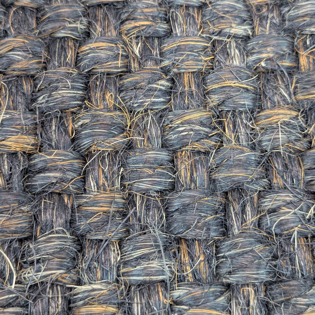 2. Detailed view of 100% sisal fibers forming a textured basket weave on a Restoration Hardware rug.