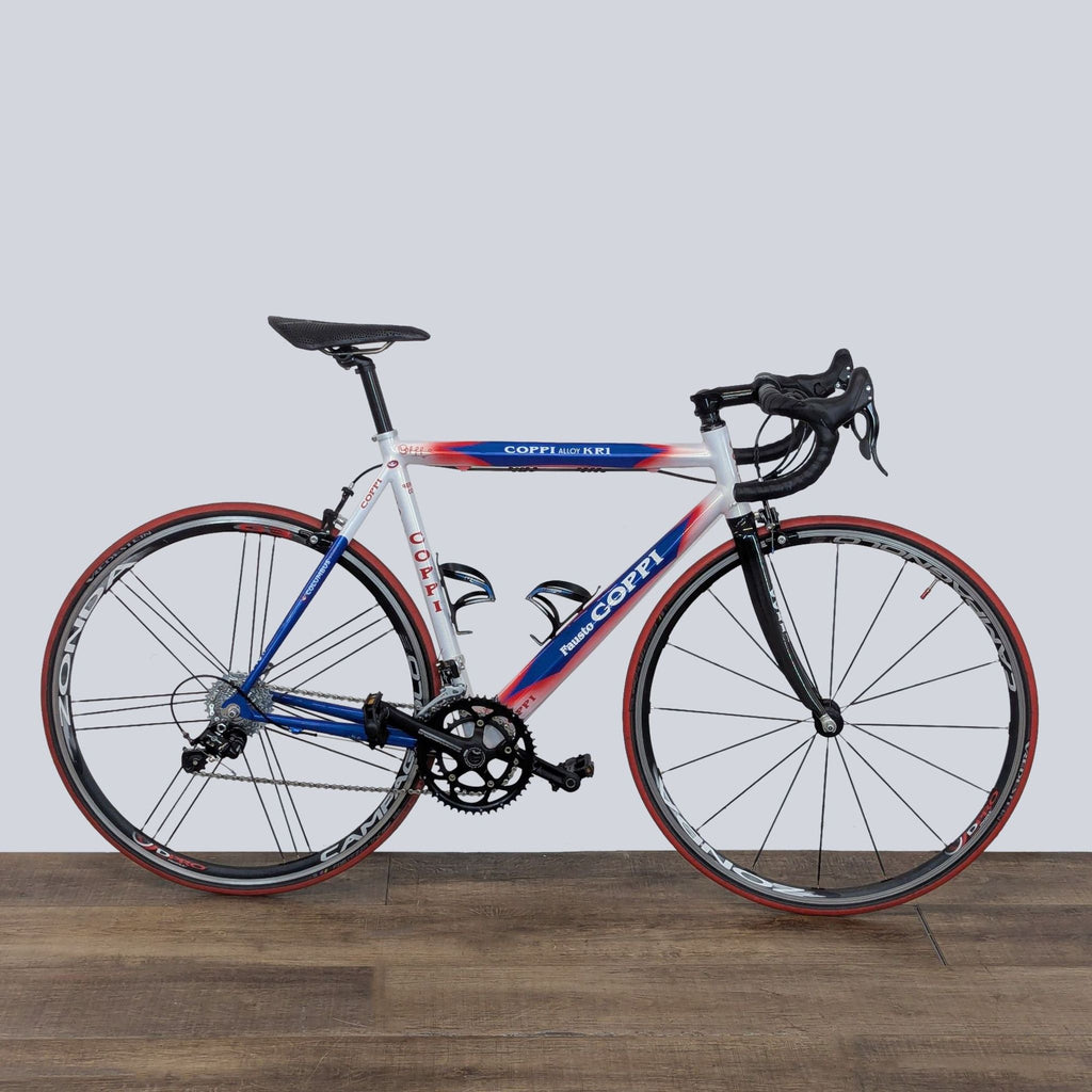 Close-up of Coppi racing bicycle showcasing precise components, slim frame, and traditional race-inspired design.
