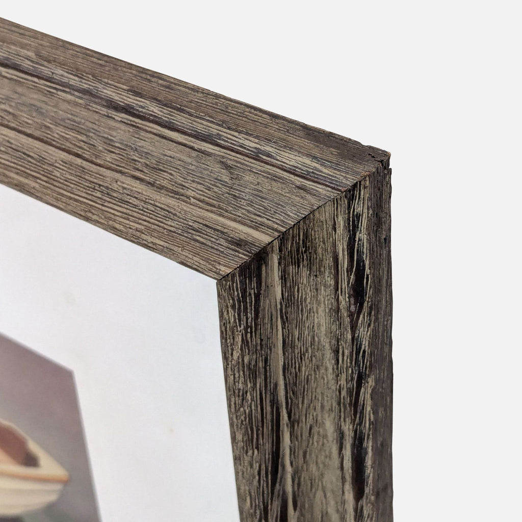 2. Close-up of the rustic wooden frame surrounding the Eve Thompson drawing, showing its textured detail.