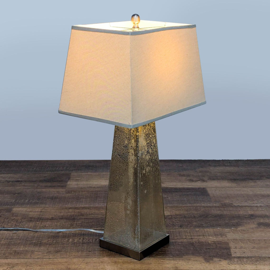 Elegant lamp by Walmart featuring a lustrous mercury glass base and soft-textured fabric shade.