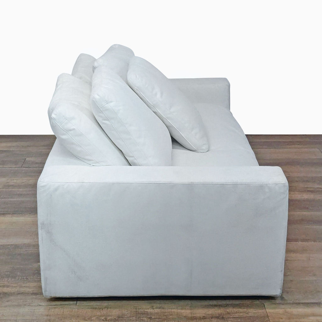 Side view of the Restoration Hardware Cloud 3-seat sofa showing thick seat/back cushions and wide track arm.  