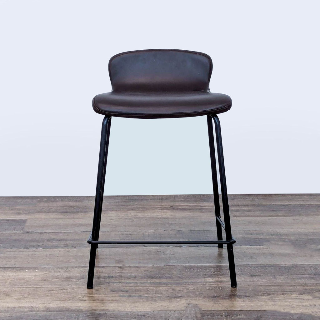 1. Lumisource faux leather stool with metal frame, low backrest, on wood floor, front view.