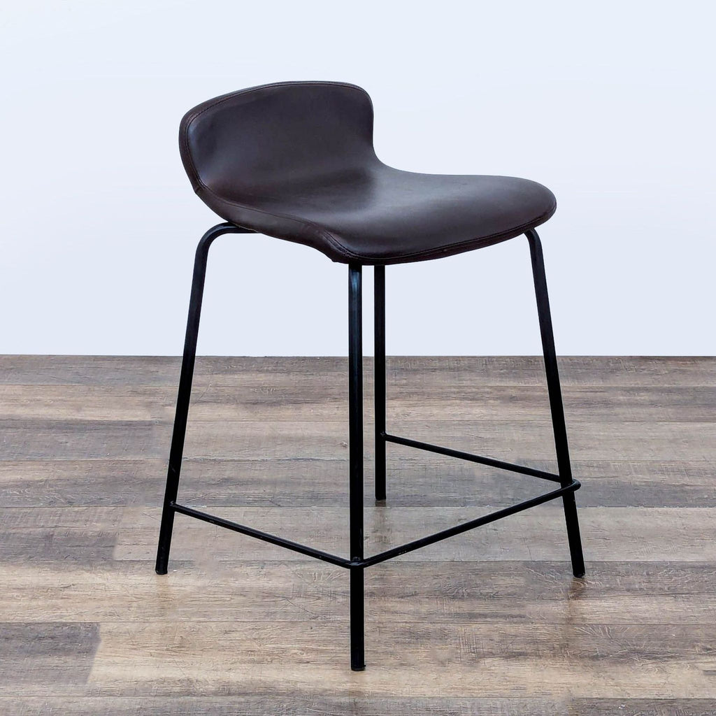 3. Angled view of Lumisource bench-style stool with faux leather seat and black metal legs on wood floor.