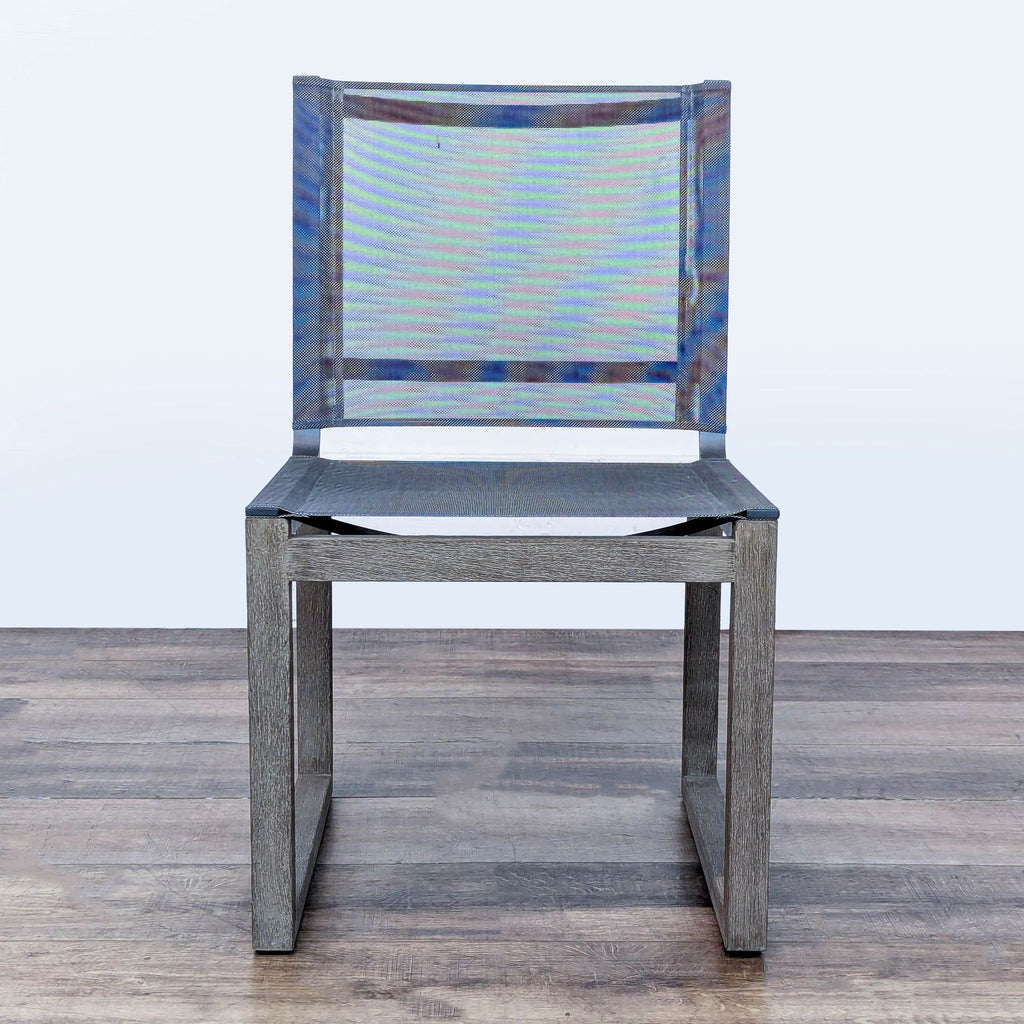 1. Front view of the Aegean outdoor dining chair by Restoration Hardware with weathered teak and charcoal mesh.