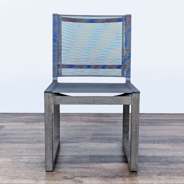 1. Front view of the Aegean outdoor dining chair by Restoration Hardware with weathered teak and charcoal mesh.