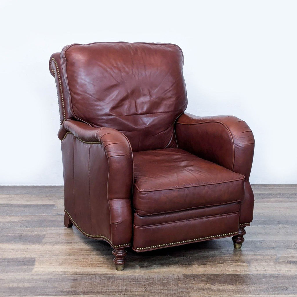 3. Angled view of Motioncraft leather lounge recliner with rolled arms, turned legs, and brass nailhead detailing.