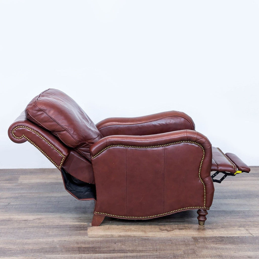 2. Side profile of Motioncraft leather pushback recliner, showing extended footrest, nailhead trim, and classic lounge style.