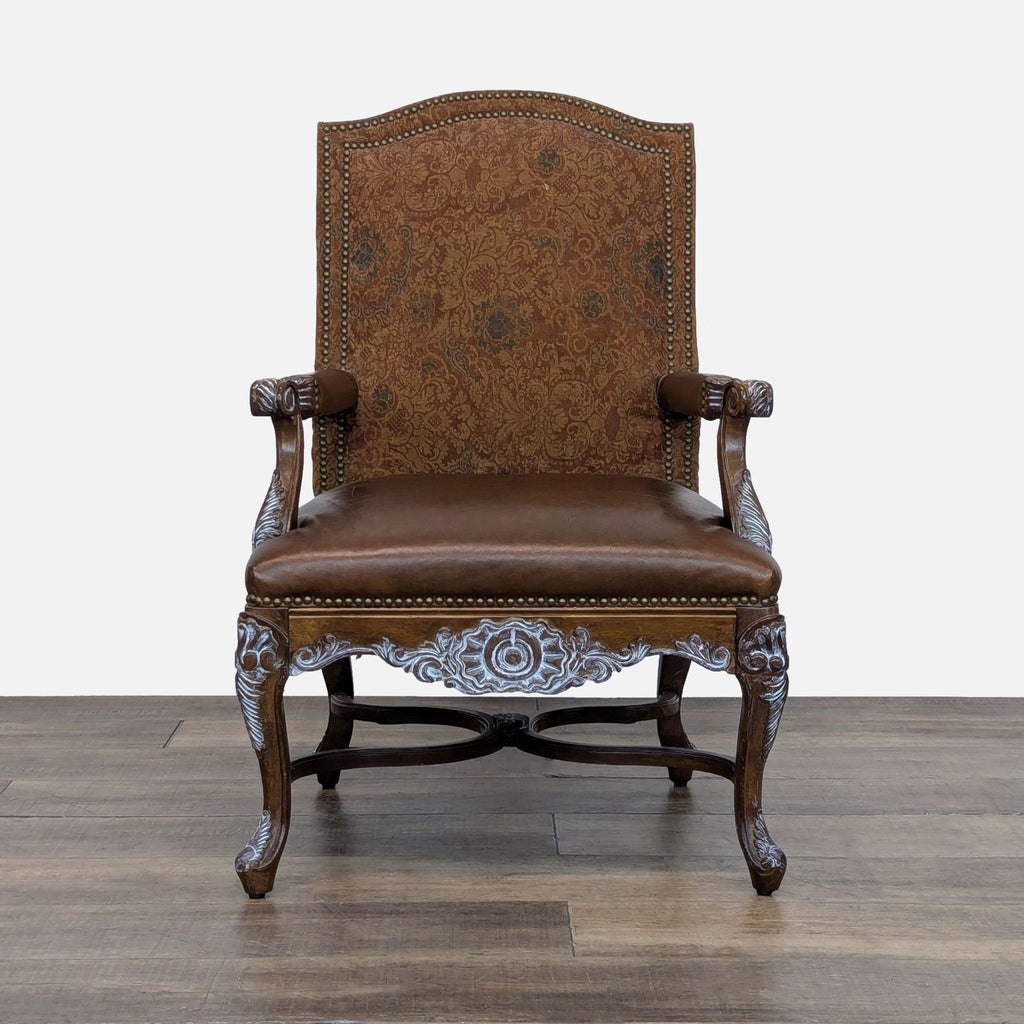Front view of an Elegant Clutter lounge chair with a high upholstered back, leather seat, and whitewashed carved wood.  