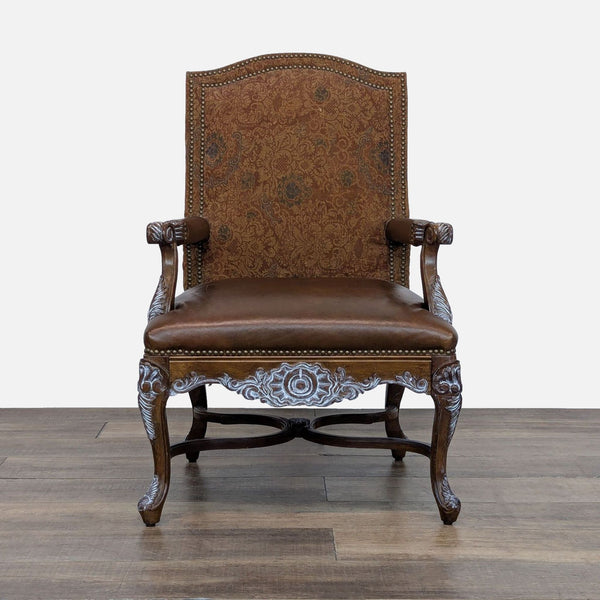 Front view of an Elegant Clutter lounge chair with a high upholstered back, leather seat, and whitewashed carved wood.  