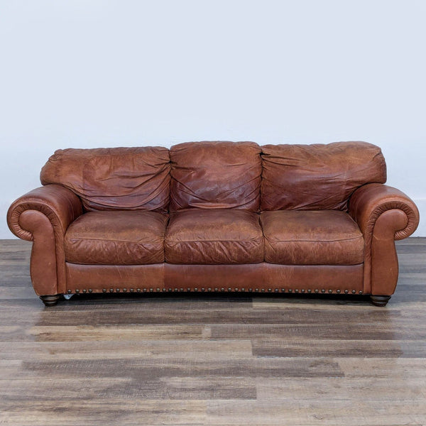 1. Reperch 3-seat sofa with rolled arms, plush cushions, and brown leather upholstery, front view.