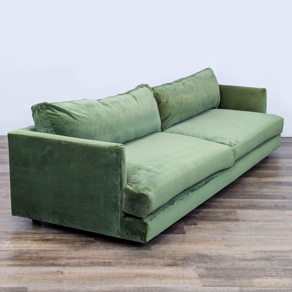 Angled view of the Haven 3-seat Tarragon Velvet sofa by West Elm, showing deep seating and soft back cushions.
