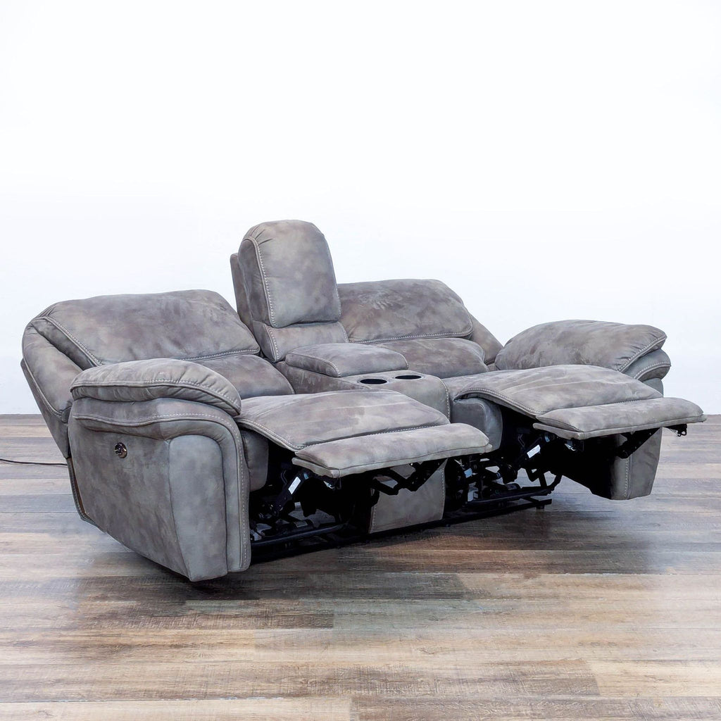 2. Reperch loveseat showing extended power recliners, central cup holders, and plush armrests for comfort.
