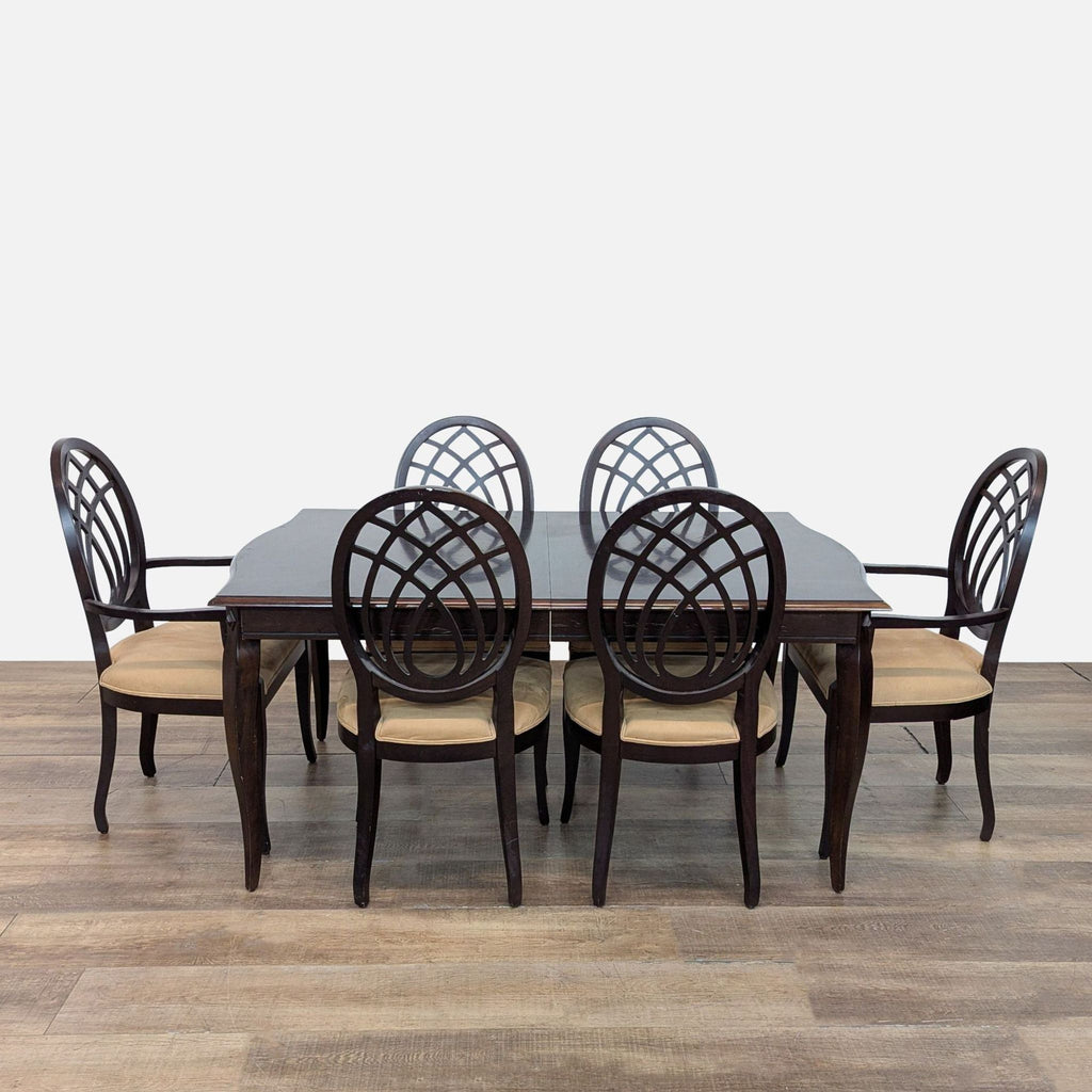 1. Mahogany dining set by The Bombay Company with six upholstered chairs and extendable table.