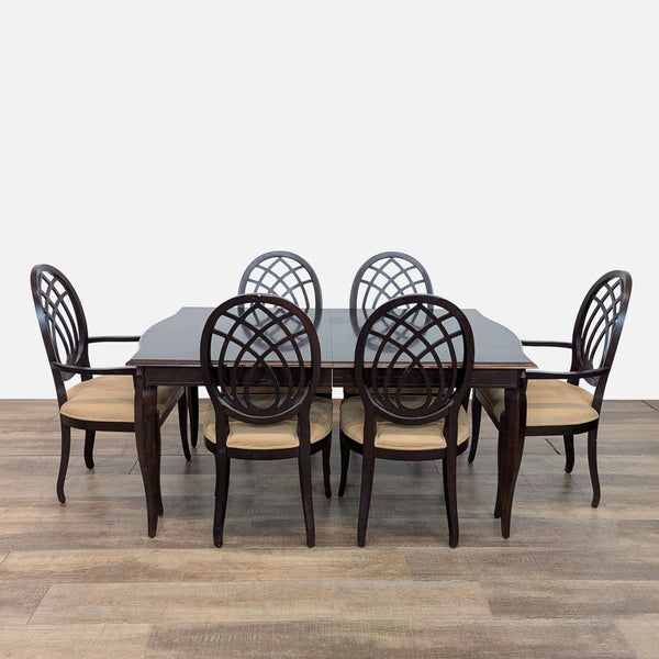 1. Mahogany dining set by The Bombay Company with six upholstered chairs and extendable table.