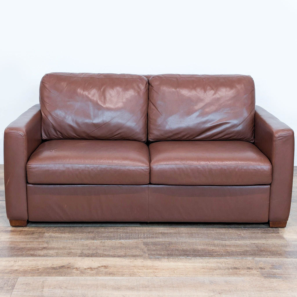 3. Track arm brown leather sleeper sofa by American Leather, shown closed with two seat cushions.