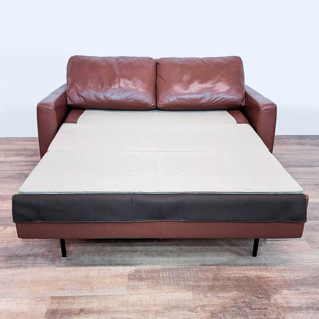 2. American Leather sleeper sofa pulled out to reveal the extended bed function and cushion support.