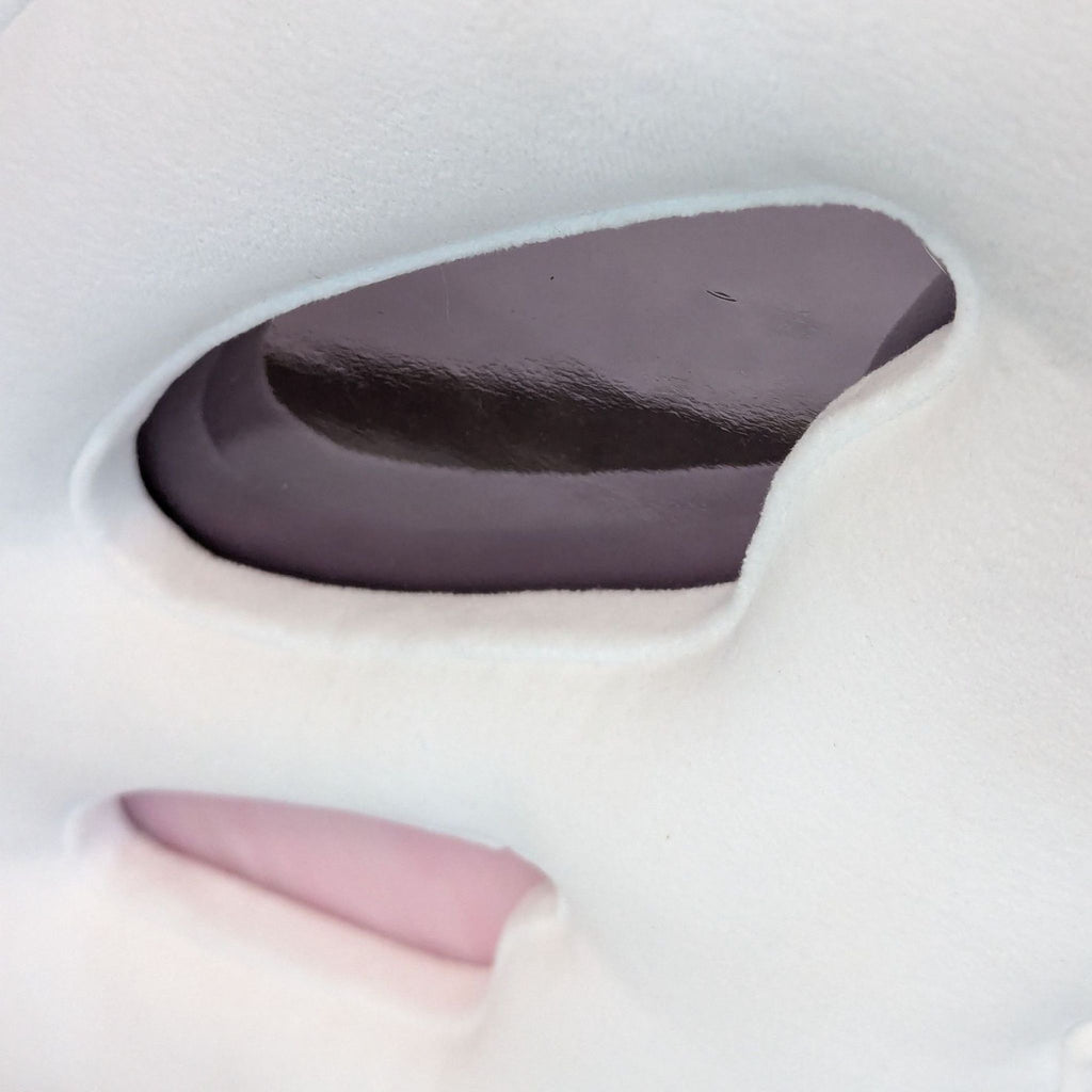 Close-up of the stained-glass detail inset in the butterfly wing back of the Haute House dining chair.