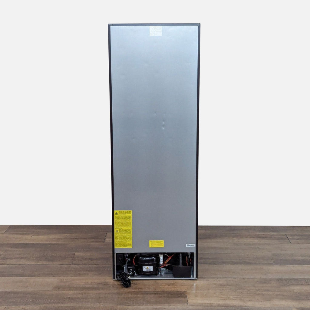 Rear view of the Summit wine refrigerator, displaying the appliance’s back panel, cord, and compressor compartment.