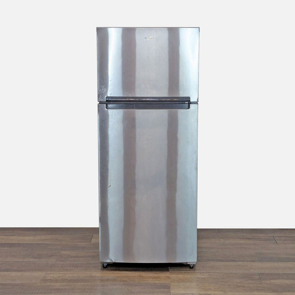 1. Front view of Whirlpool stainless steel top freezer refrigerator featuring a sleek, modern design on wood floor.