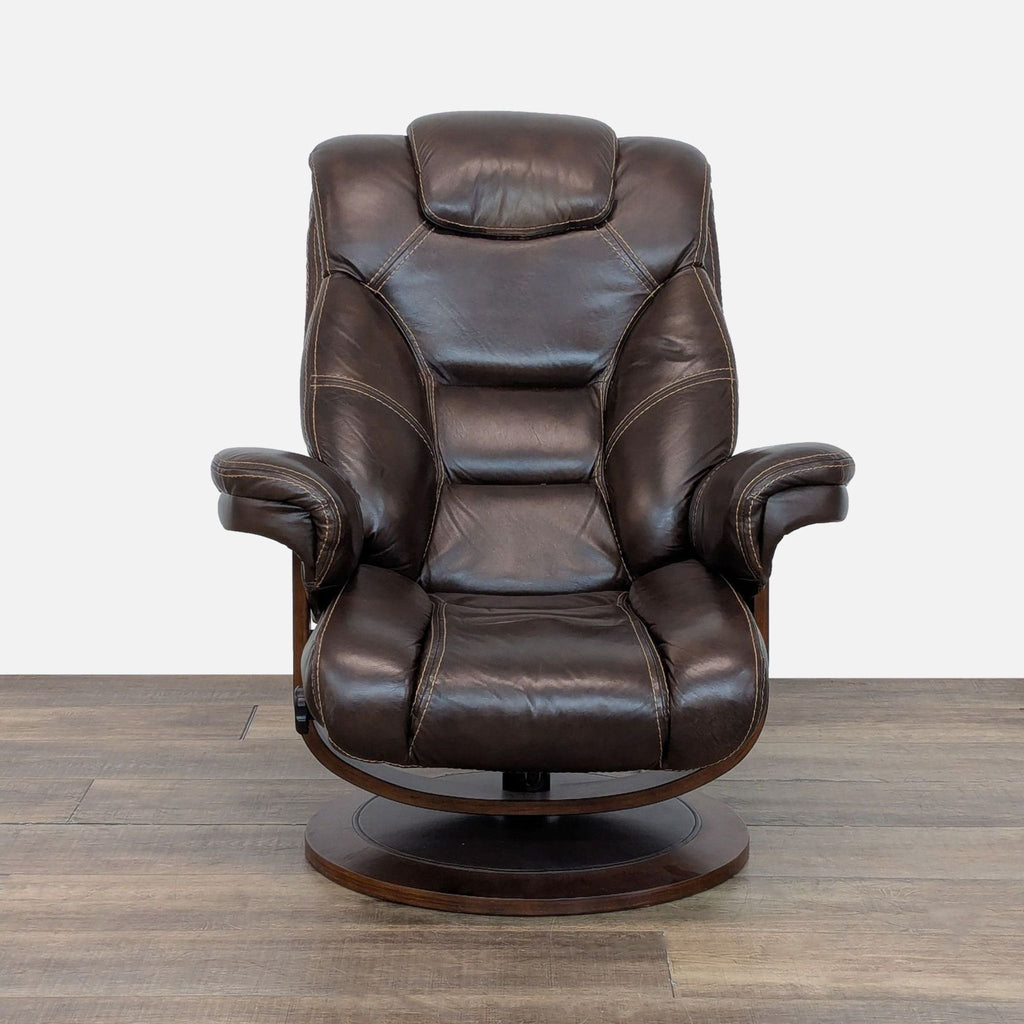 1. Macy’s lounge chair with plush leather cushioning and a walnut wood base, shown from the front.