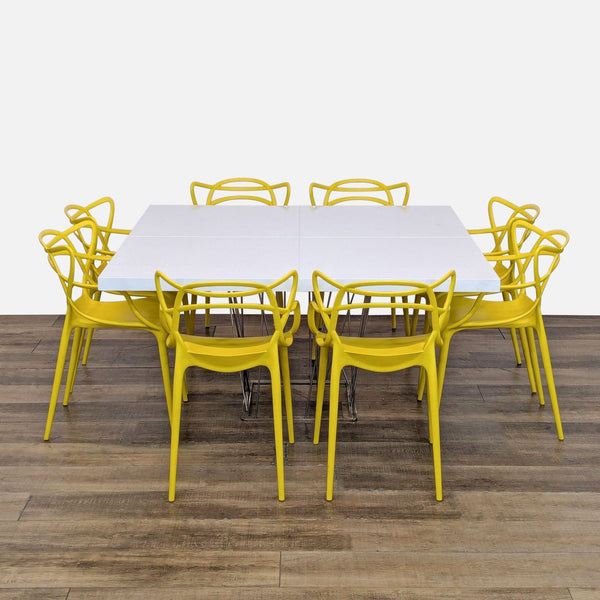 1. Modloft dining set with white lacquer table, wiry steel base, and 8 yellow Masters-style chairs.