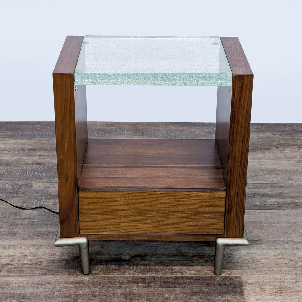 1. Caracole end table made of dark wood with a single drawer and a clear, bubble-accented light-up acrylic top.