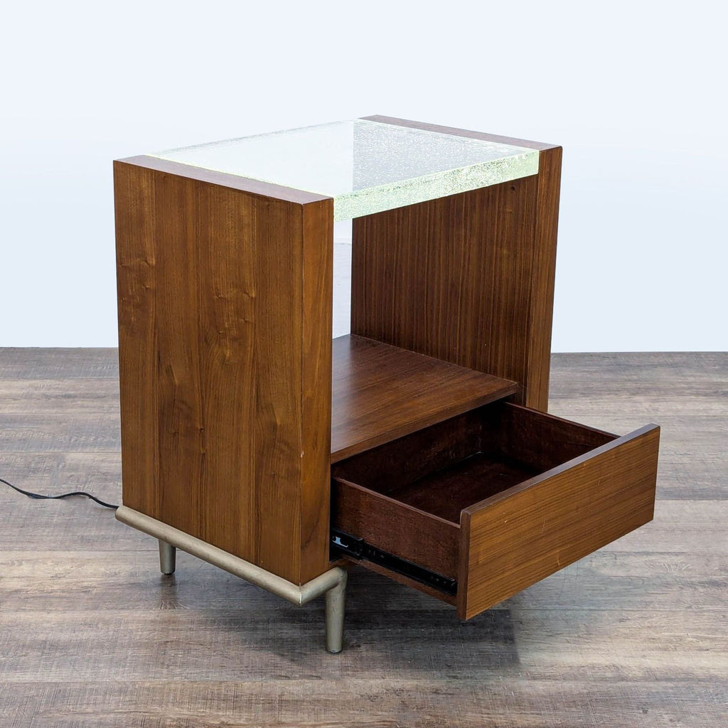 2. Wooden Caracole end table with metal legs, open drawer, and illuminated acrylic top featuring bubble details.