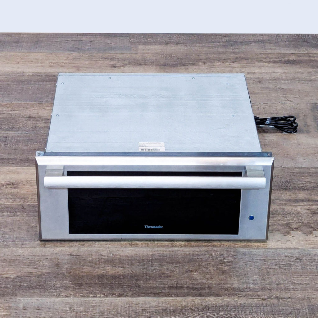 2. Overhead view of a Thermador WD27ES stainless steel warming drawer with a spacious design for kitchen use.