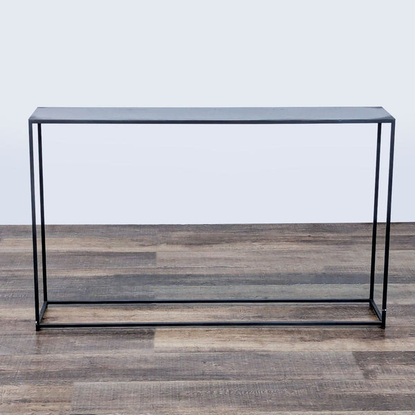 1. Minimalist all metal console table by CB2, with slim rectangular design on wood flooring, front view.  