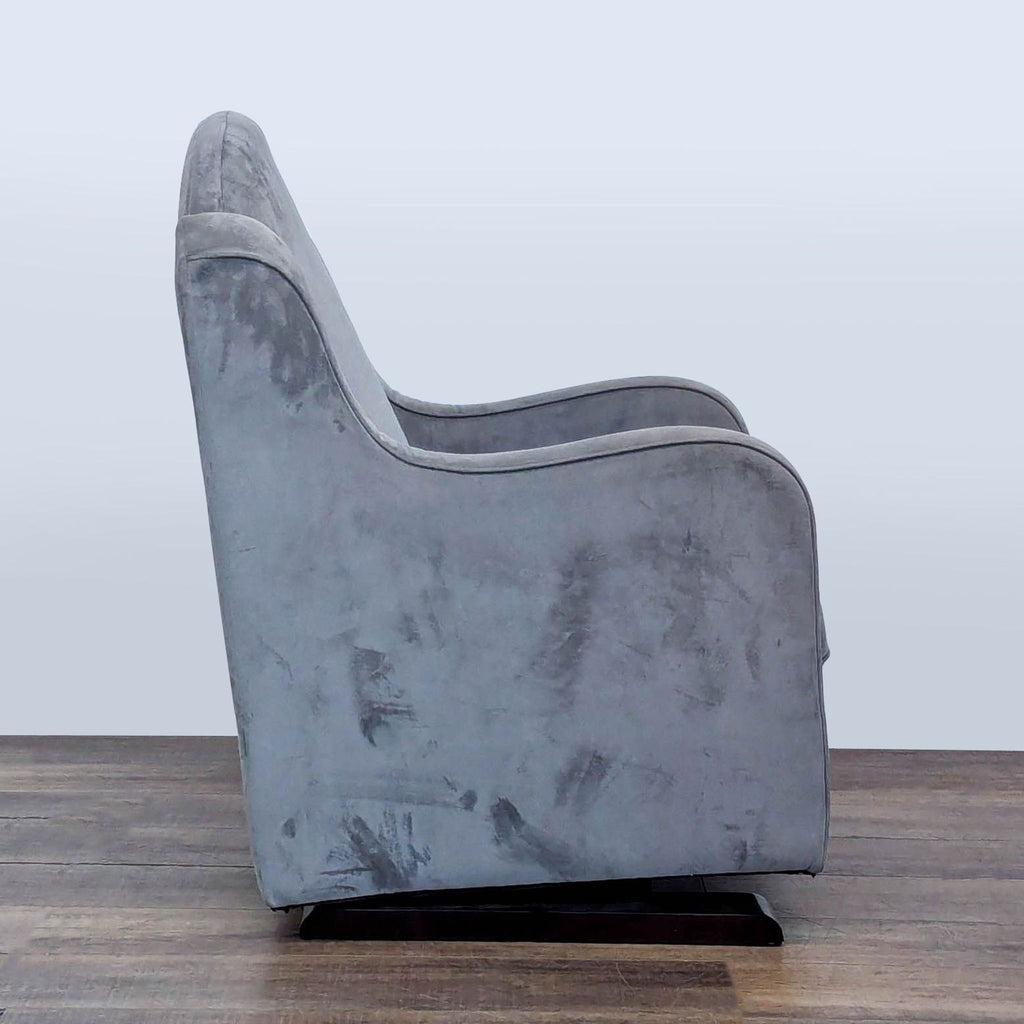 Side profile of a Reperch lounge chair, showing its curved armrests and plush chenille upholstery.