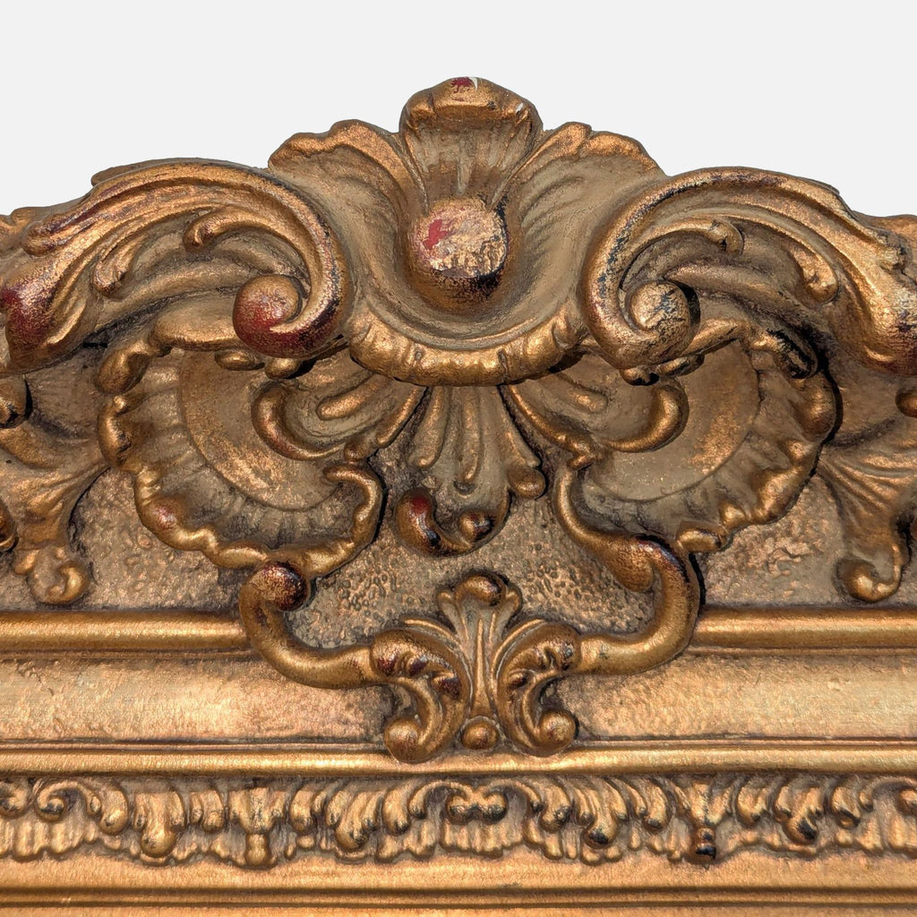 3. Detailed view of the Reperch mirror frame highlights elaborate scrollwork and floral carvings in a gold finish.