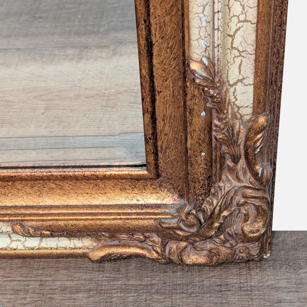 3. Close-up of the ornate corner on a carved and gilded Reperch mirror frame with crackle glaze effect.
