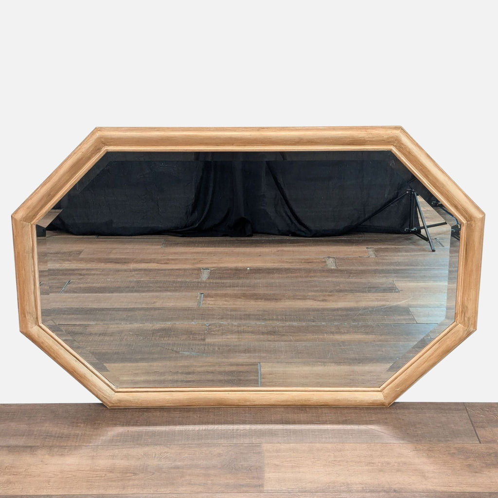 1. Octagonal Reperch mirror with a light wood frame, shown resting on a wooden floor.