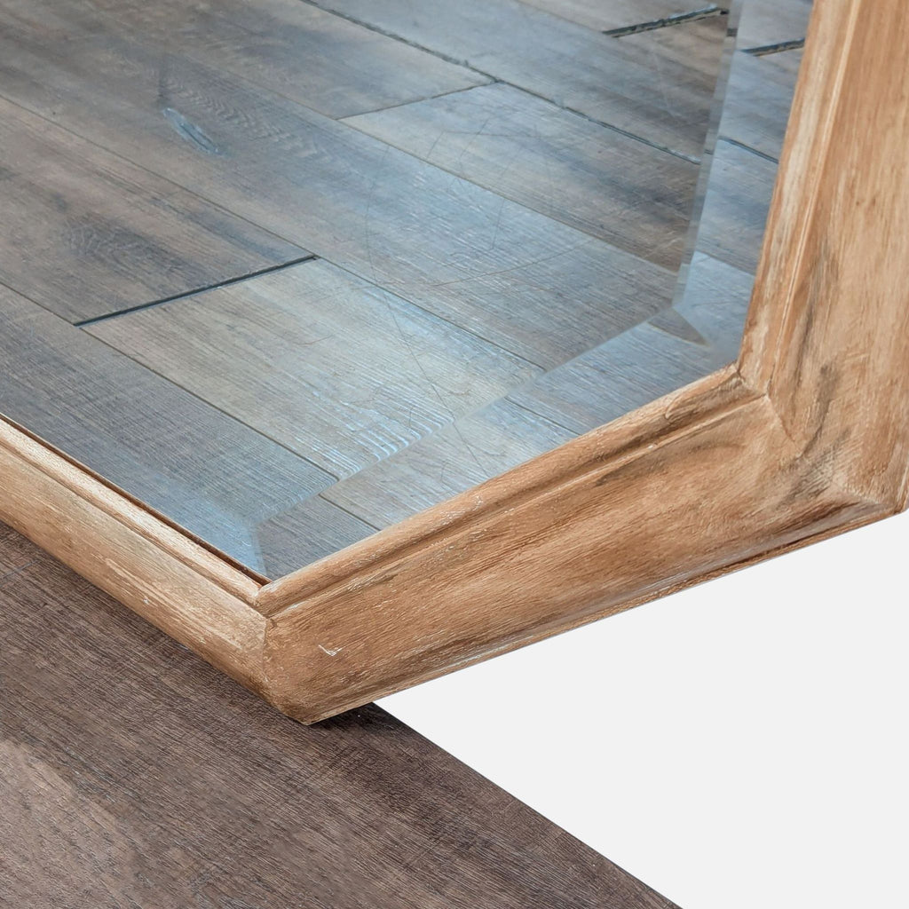 2. Close-up of the Reperch mirror’s wood frame corner and the edge of the reflective glass.