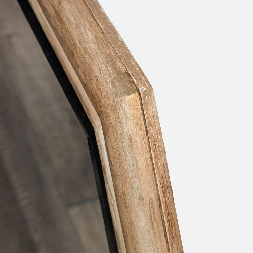 3. Detailed view of the Reperch mirror’s beveled wooden edge, emphasizing the natural grain.