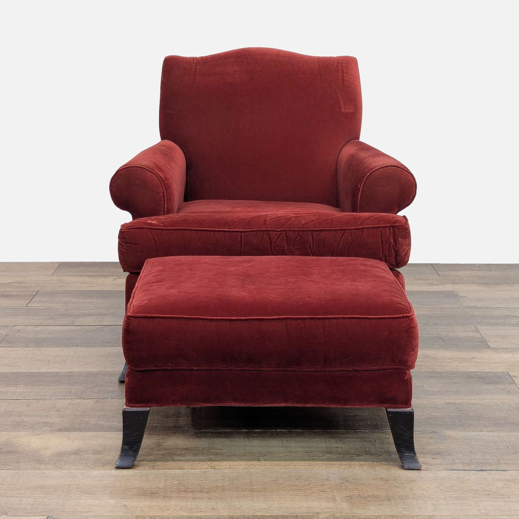 3. Front view of a Crate & Barrel red lounge chair and ottoman set with curved back and rolled arms.