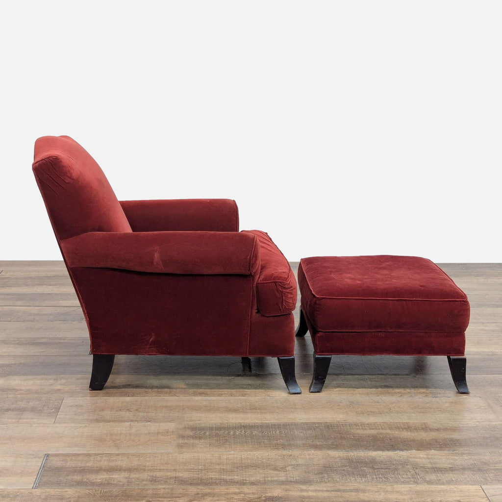 2. Side view of a Crate & Barrel lounge chair in red with ottoman, rolled arms, and wooden feet.  