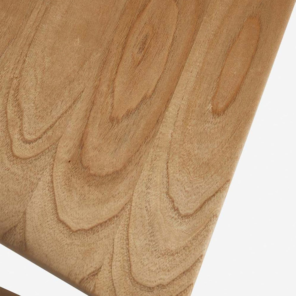 3. Detailed look at the natural mindi wood grain on a Lulu and Georgia dining chair, mid-century style.
