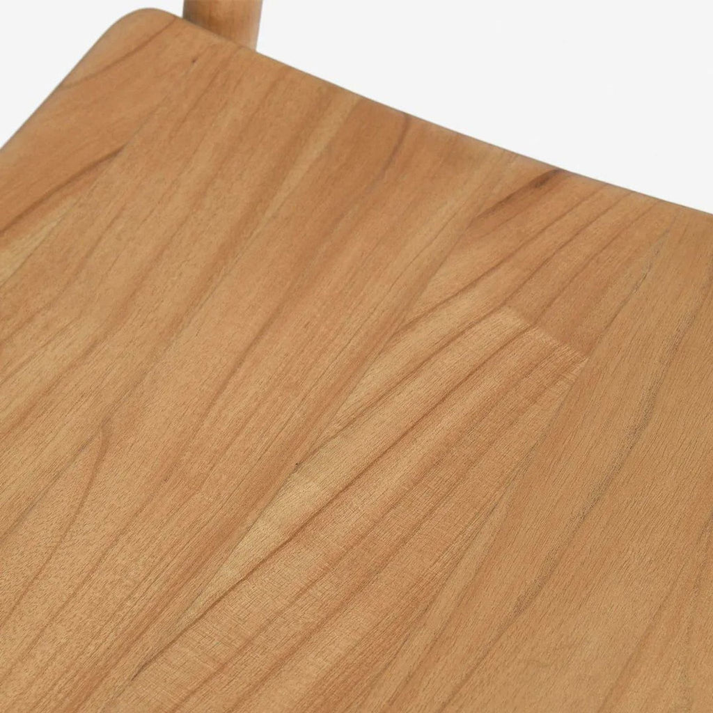 Close-up detail of the mindi wood seat on a mid-century Lulu and Georgia dining chair, showing wood grain.