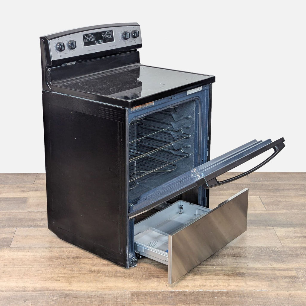 2. Angled view of Amana electric range with oven and bottom drawer open, showing interior racks and storage.