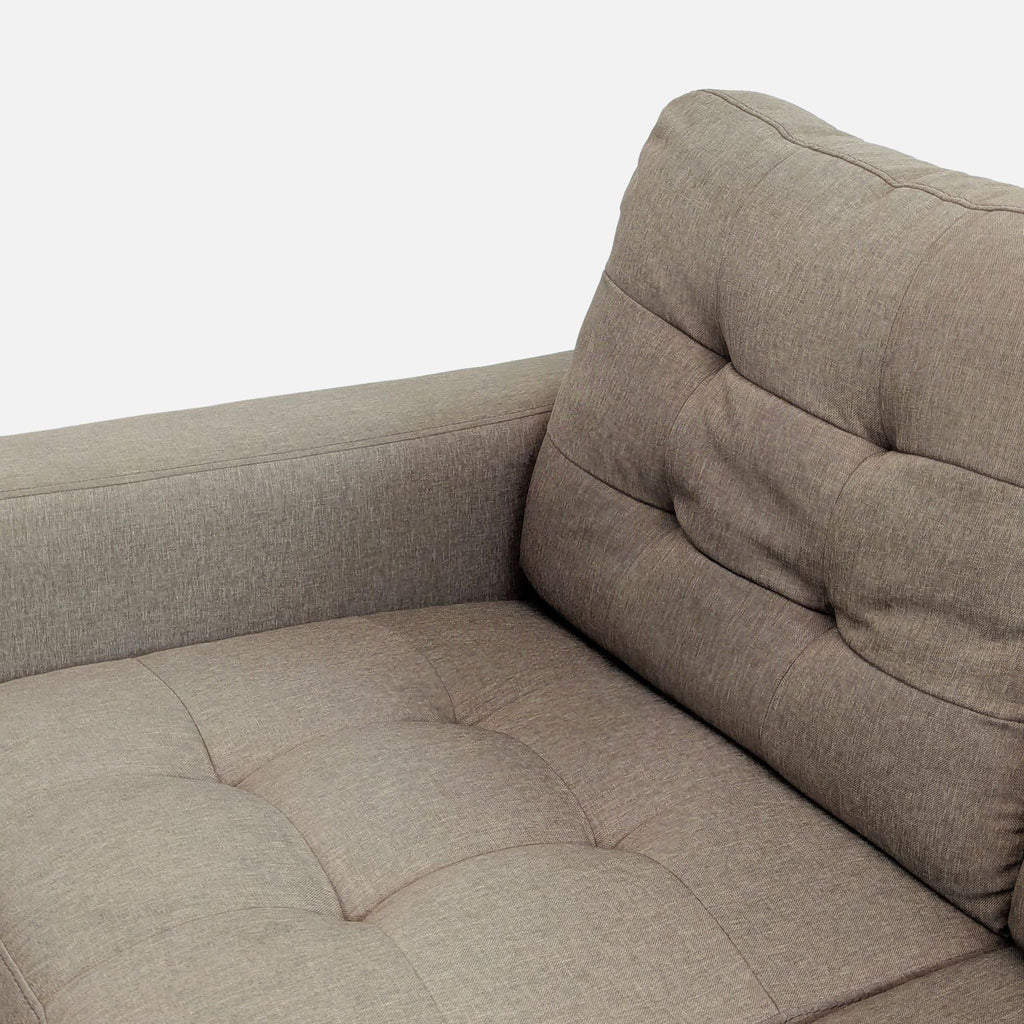 3. Close-up of taupe tufted Amazon loveseat upholstery, highlighting cushion details and stitching.