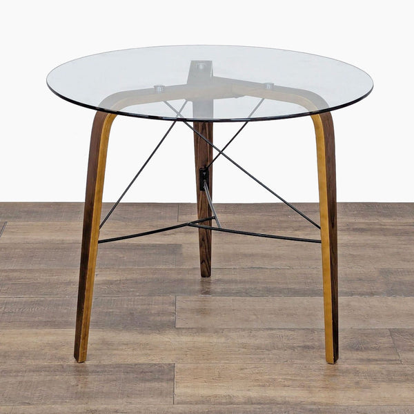 1. Sapphtopaz industrial round dining table with metal base and tempered glass top, on wooden floor.