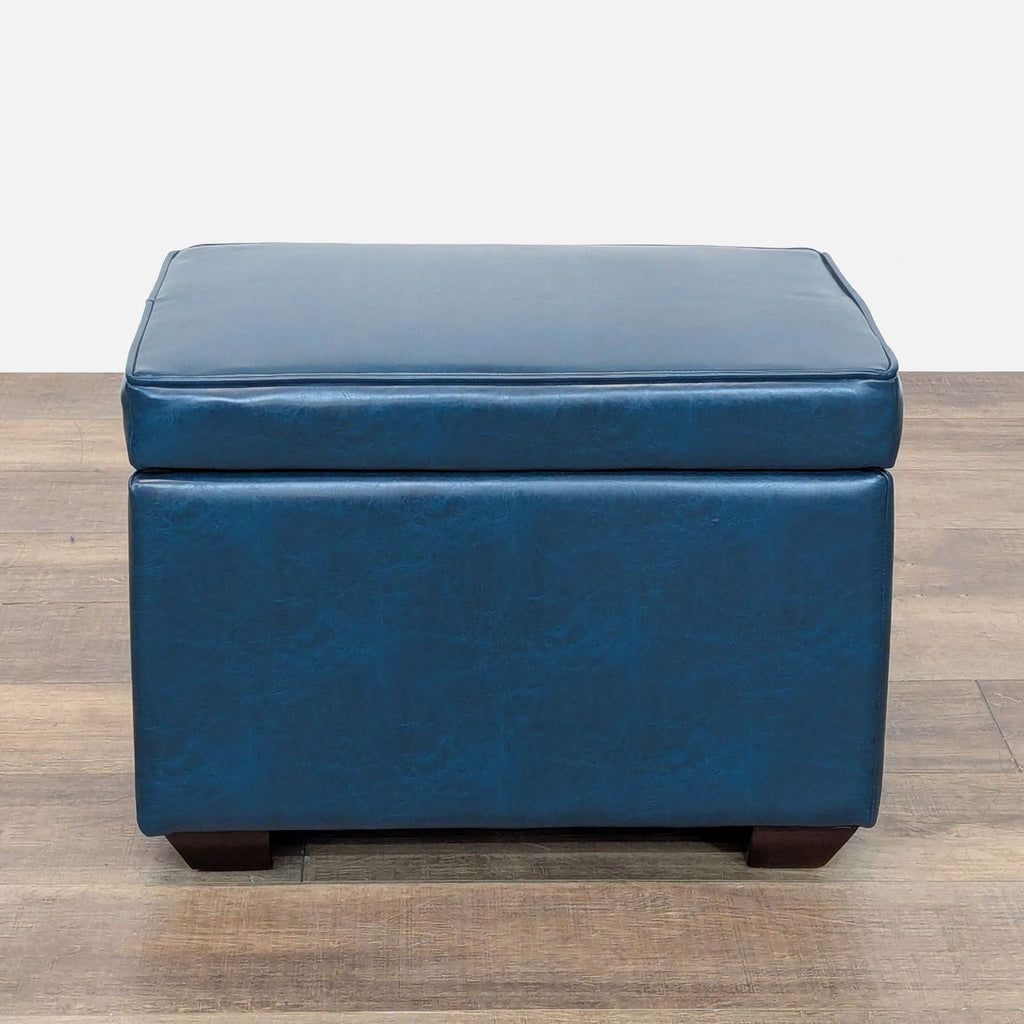 1. Reperch blue ottoman with cushioned top, shown on wood floor, for Stools, Ottomans & Benches category.