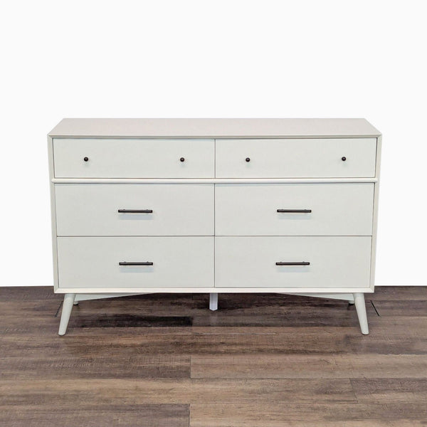 1. White mid-century modern dresser by Najarian Furniture, featuring six drawers with metal handles, front view.