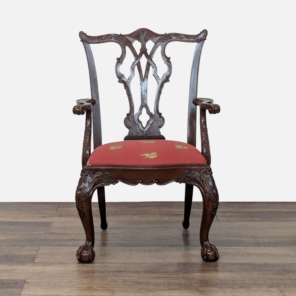 Front view of a Henredon English Chippendale dining chair, showing detailed carving and red upholstery.  