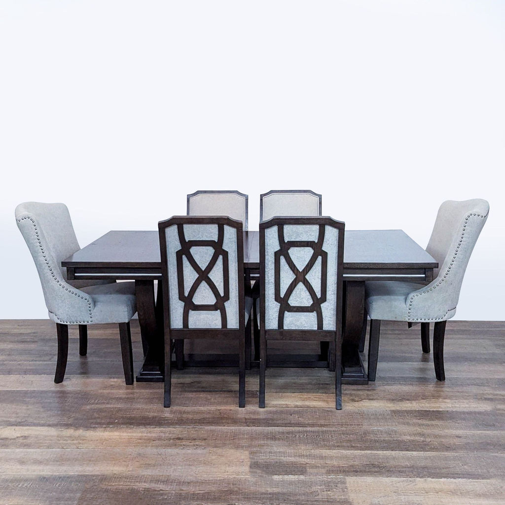 1. Ashley Furniture dining set with extendable table, four dining chairs, and two arm chairs in neutral tones.  