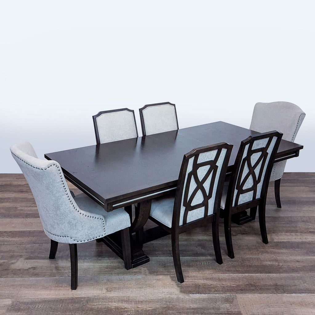 3. Angled view of an Ashley Furniture dining set, featuring an extendable table, four dining chairs, and two arm chairs.