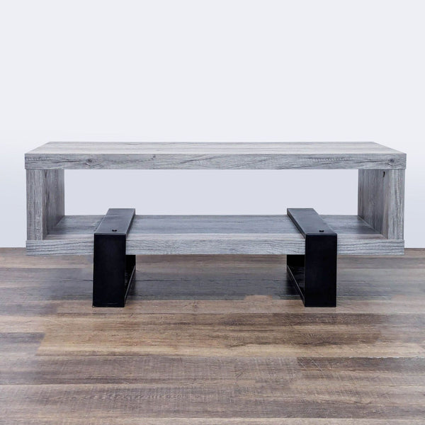 1. Coaster coffee table with driftwood finish and metal legs, featuring a modern two-tiered rectangular design.