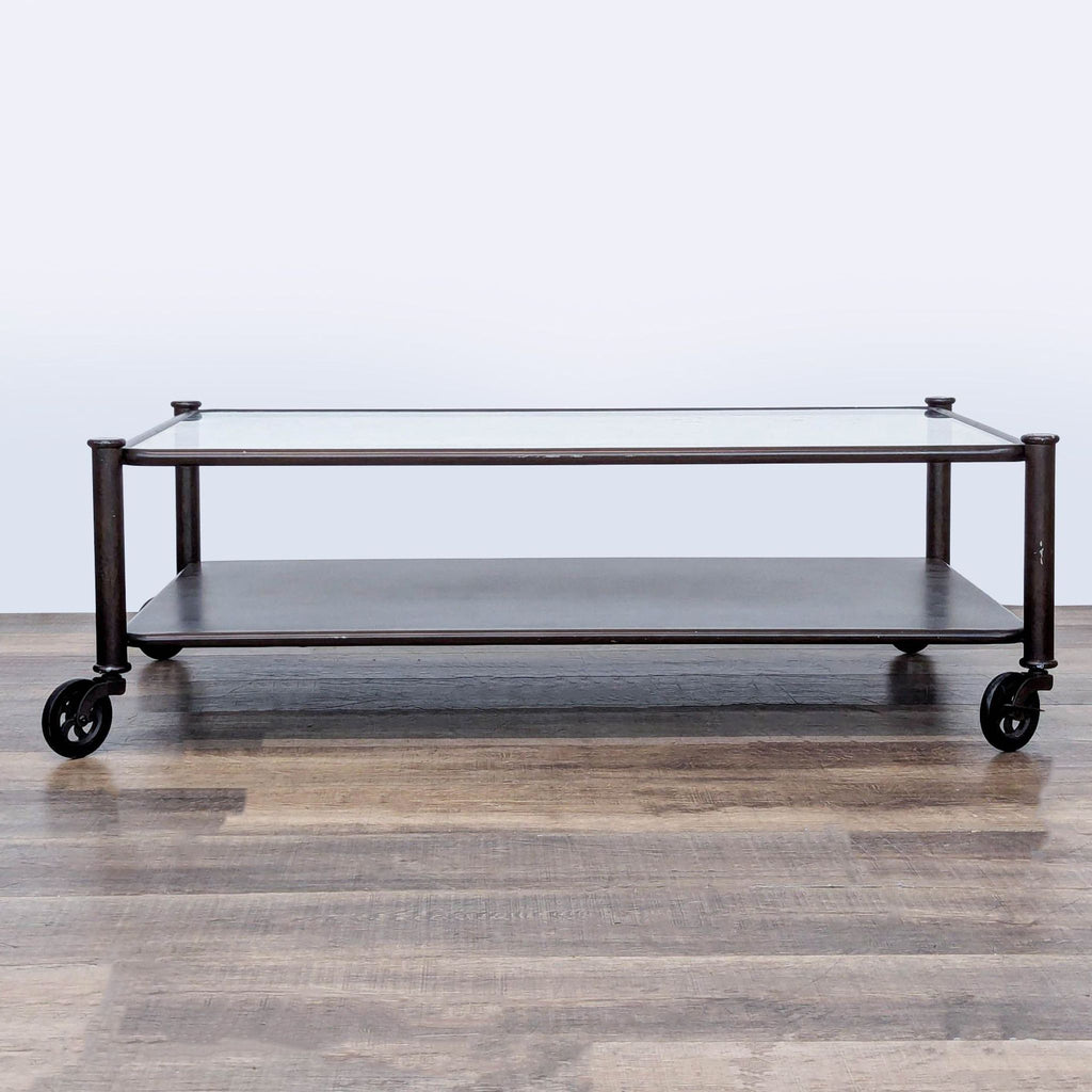 1. Reperch coffee table with glass top, lower shelf, and black metal frame on four caster wheels.