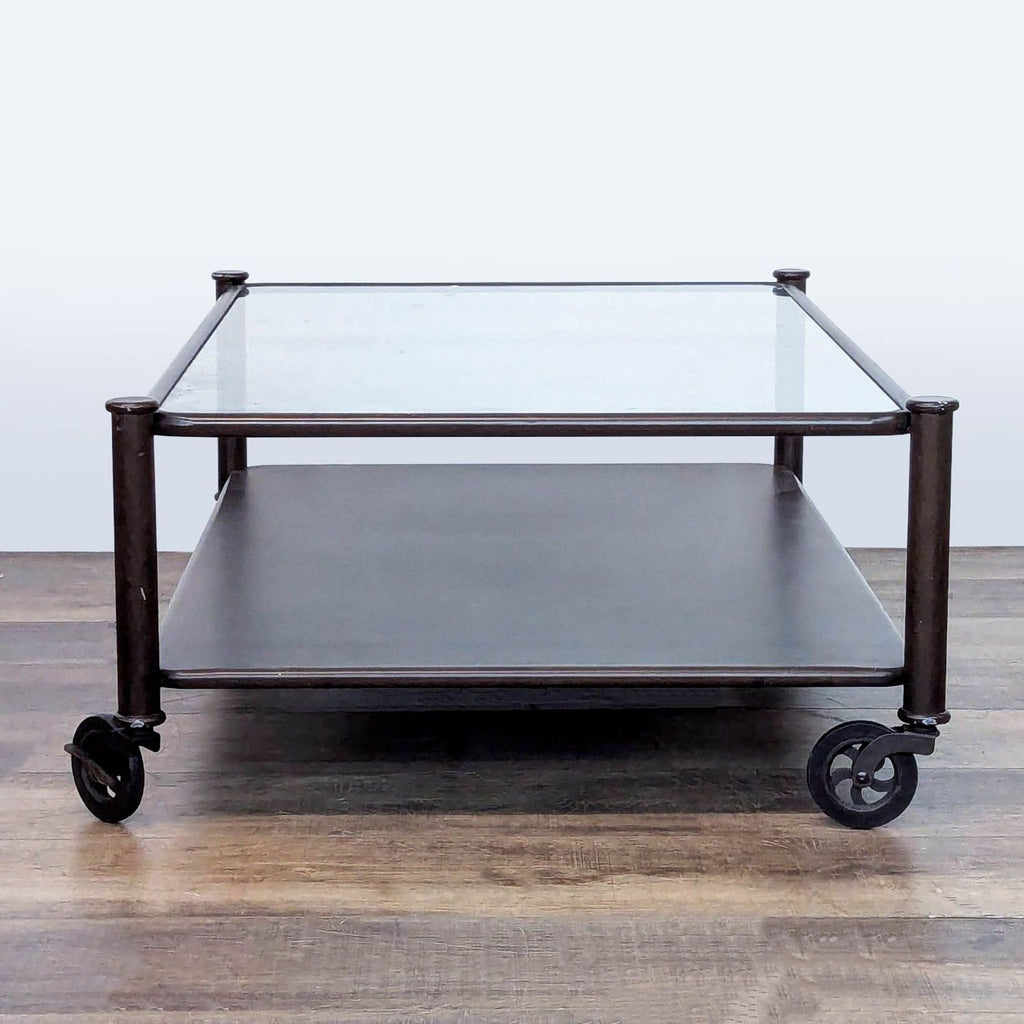3. Rectangular Reperch coffee table with glass surface, sturdy metal frame, lower shelf, and caster wheels.